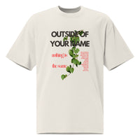 Flat lay of cream 'Outside of Your Name' oversized Christian tee – bold red and green fig vine artwork with scripture-inspired message – Influence View