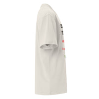 Side view of cream oversized Christian tee – ‘Outside of Your Name’ design with red, green, and black organic elements – Influence View