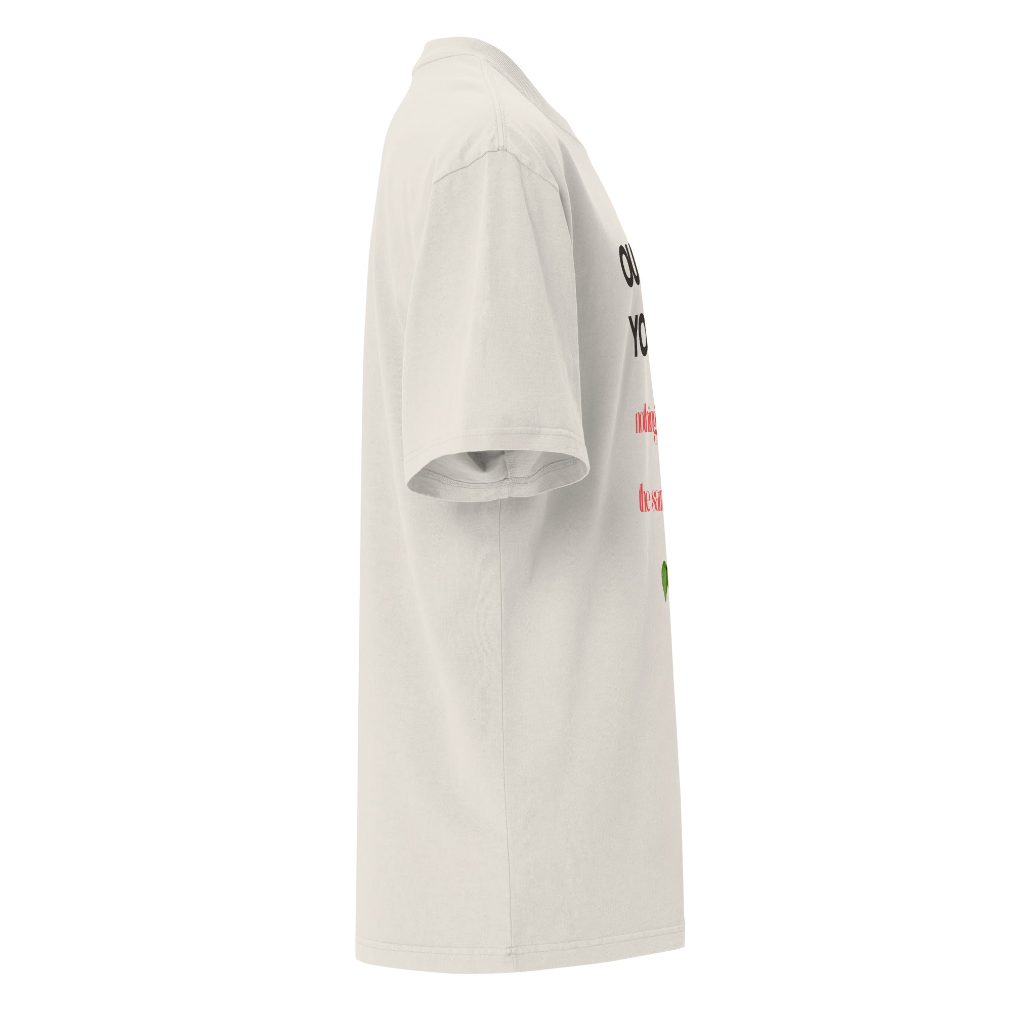 Side view of cream oversized Christian tee – ‘Outside of Your Name’ design with red, green, and black organic elements – Influence View