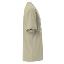 Opposite side view of a Christian oversized T-shirt in muted green. Shows drape and silhouette with partial view of front design.
